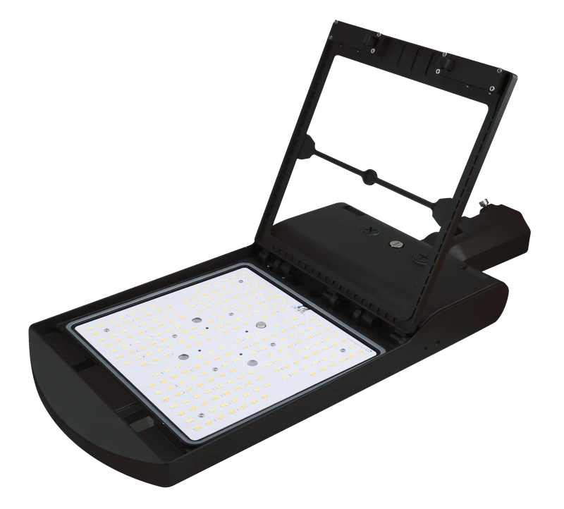 LSBX Liberty — PRO shoebox area light with modular optic accessories (Type II / III / IV / V swappable as separate /OT2 /OT3 /OT4 /OT5 SKUs), glare shield options, 7-pin NEMA twist-lock photocell receptacle upgrade, 50-450W range across five housing classes, TAA-Compliant Mexico variants for federal / GSA projects