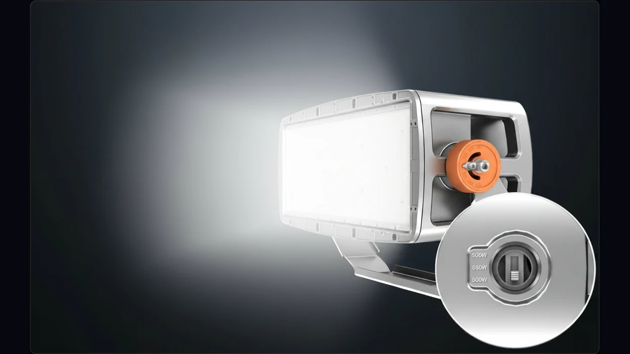 Archipelago Illuminator floodlight with WATTselect detail inset — 3-position DIP switch labeled 500W / 650W / 800W on the driver compartment