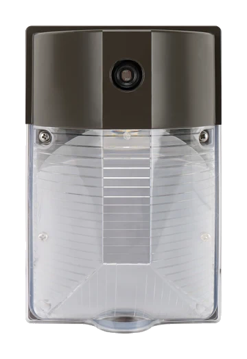 Wedge — straight-on front view, dark bronze, photocell port visible on upper housing face, clear lens showing LED array